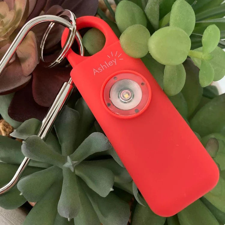 Ashley, your personal safety alarm, in red
